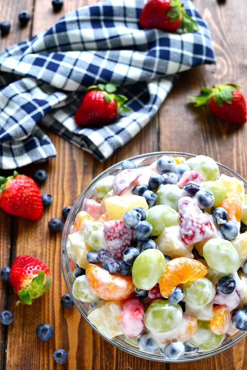 This Skinny Ambrosia Fruit Salad combines 5 types of fruit with a sweetened Greek yogurt sauce - the perfect {healthier} way to dress up your ordinary fruit salad!