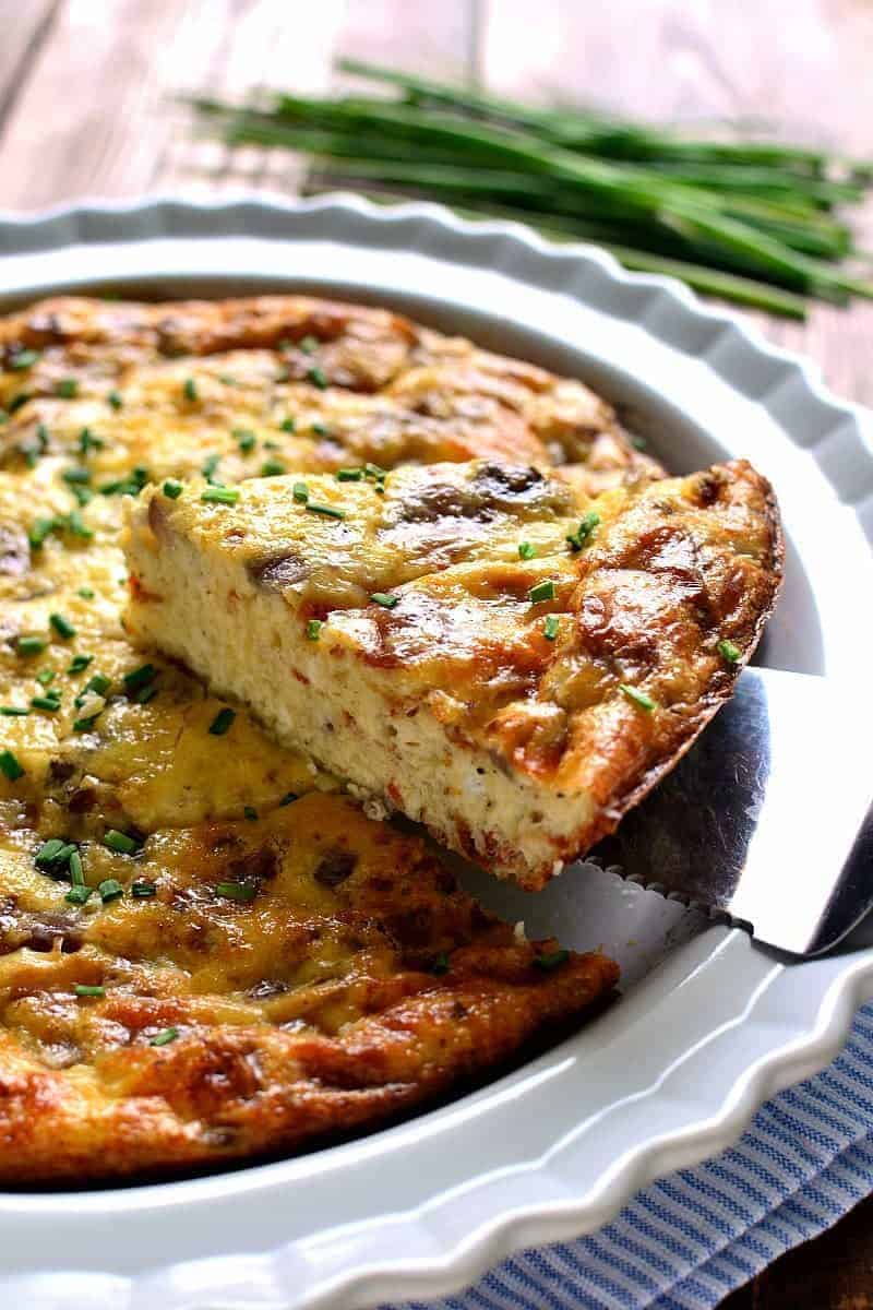 This Crustless Quiche Lorraine is a delicious twist on a classic recipe. Loaded with bacon, eggs, Swiss cheese, and cream, it has so much flavor you'll never even miss the crust! Perfect for Easter brunch or anytime you want an impressive, easy, and delicious breakfast!