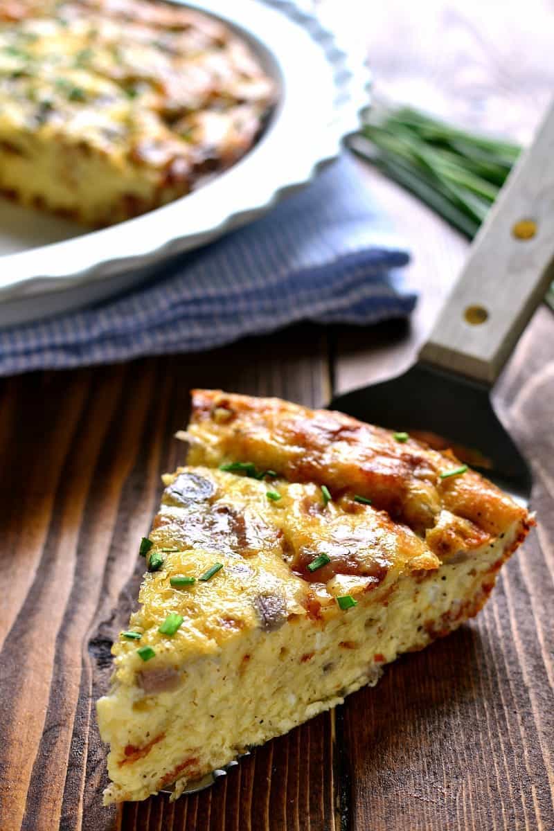 This Crustless Quiche Lorraine is a delicious twist on a classic recipe. Loaded with bacon, eggs, Swiss cheese, and cream, it has so much flavor you'll never even miss the crust! Perfect for Easter brunch or anytime you want an impressive, easy, and delicious breakfast!