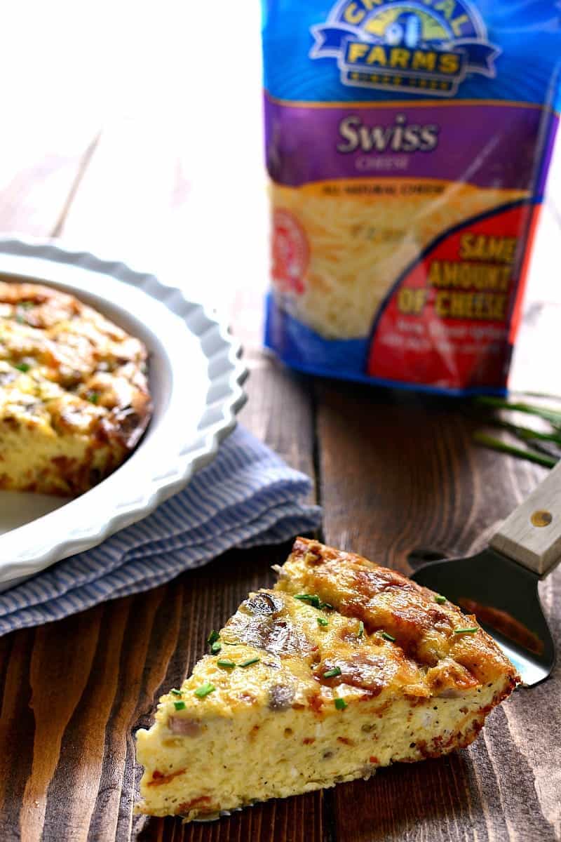 This Crustless Quiche Lorraine is a delicious twist on a classic recipe. Loaded with bacon, eggs, Swiss cheese, and cream, it has so much flavor you'll never even miss the crust! Perfect for Easter brunch or anytime you want an impressive, easy, and delicious breakfast!