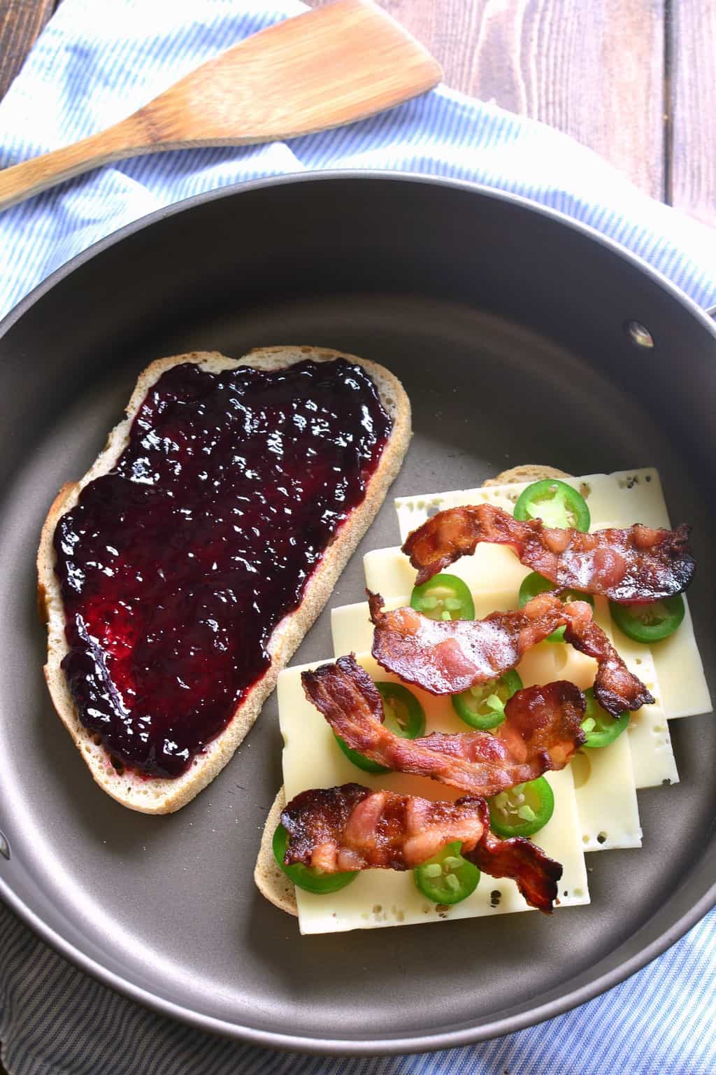 Blackberry Bacon Grilled Cheese sandwich cooking in a frying pan