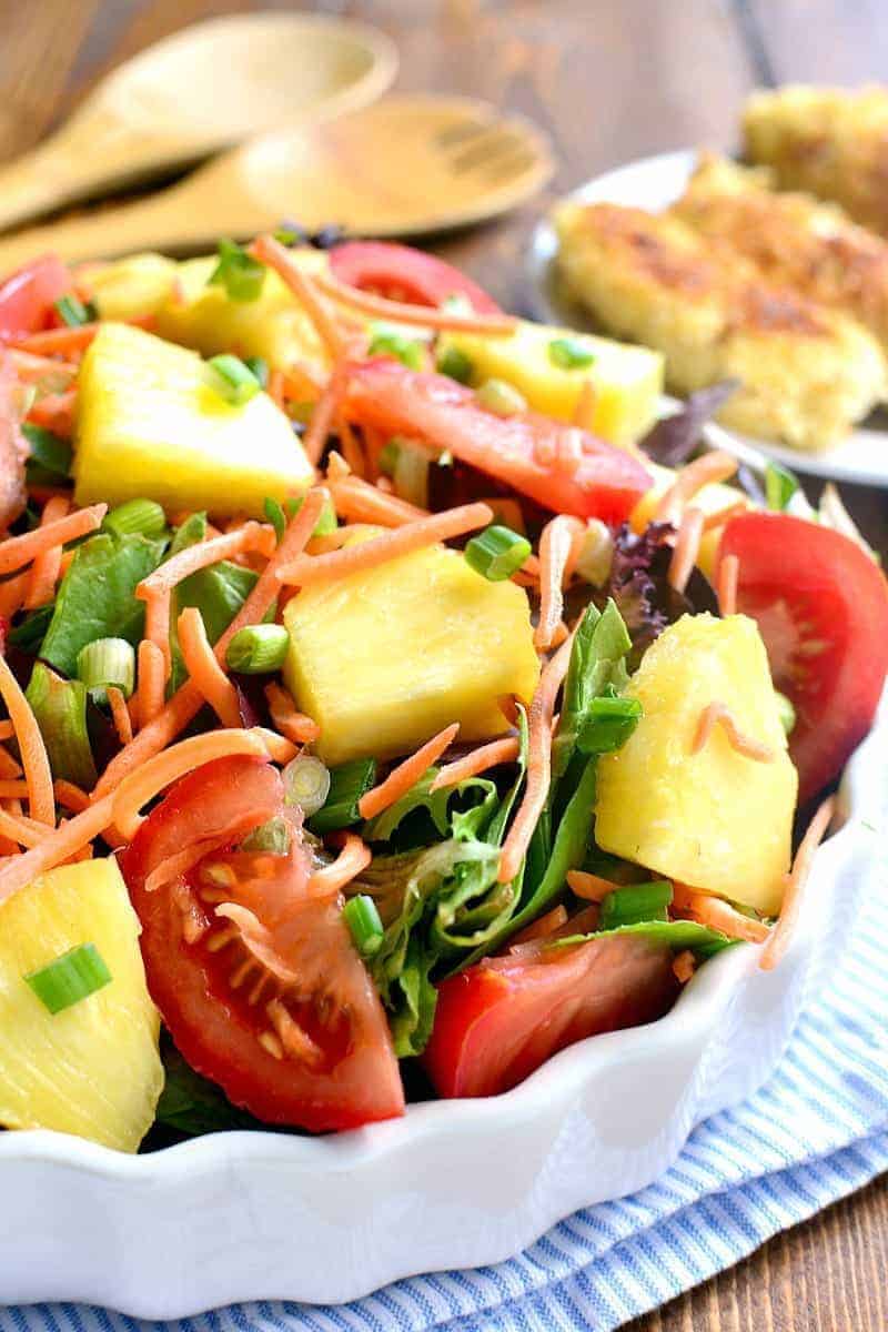 This Pineapple Crunch Salad is loaded with fresh pineapple, tomatoes, carrots, green onions, and crispy chicken....and topped with the BEST homemade honey mustard dressing. A salad and a meal, all in one!