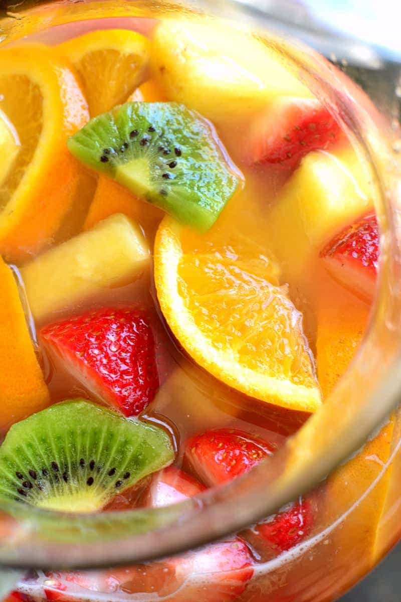 overhead image of a pitcher full of Tropical White Wine Summer Sangria 