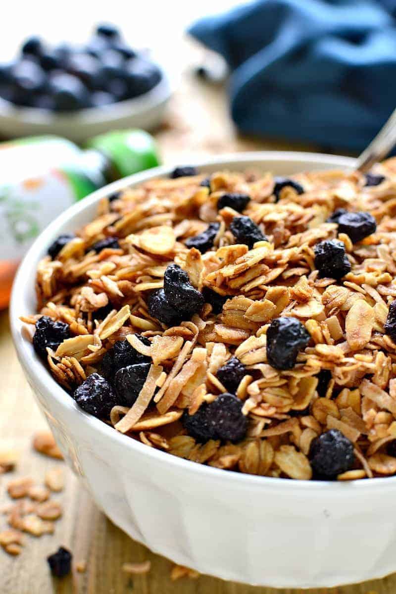 Homemade Blueberry Granola, packed with sliced almonds, toasted coconut, and dried blueberries. This granola is sweet, crunchy, and so delicious with yogurt, milk, or by the handful!