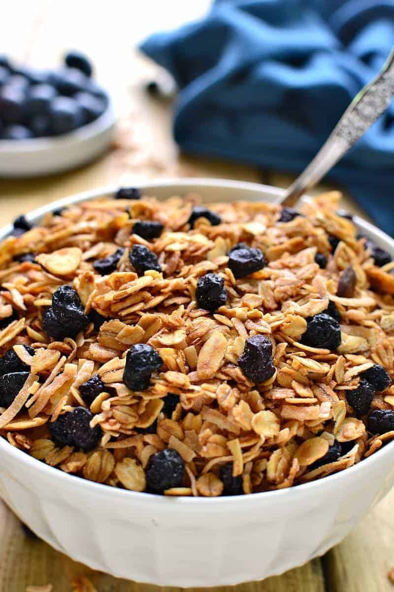 Homemade Blueberry Granola, packed with sliced almonds, toasted coconut, and dried blueberries. This granola is sweet, crunchy, and so delicious with yogurt, milk, or by the handful!