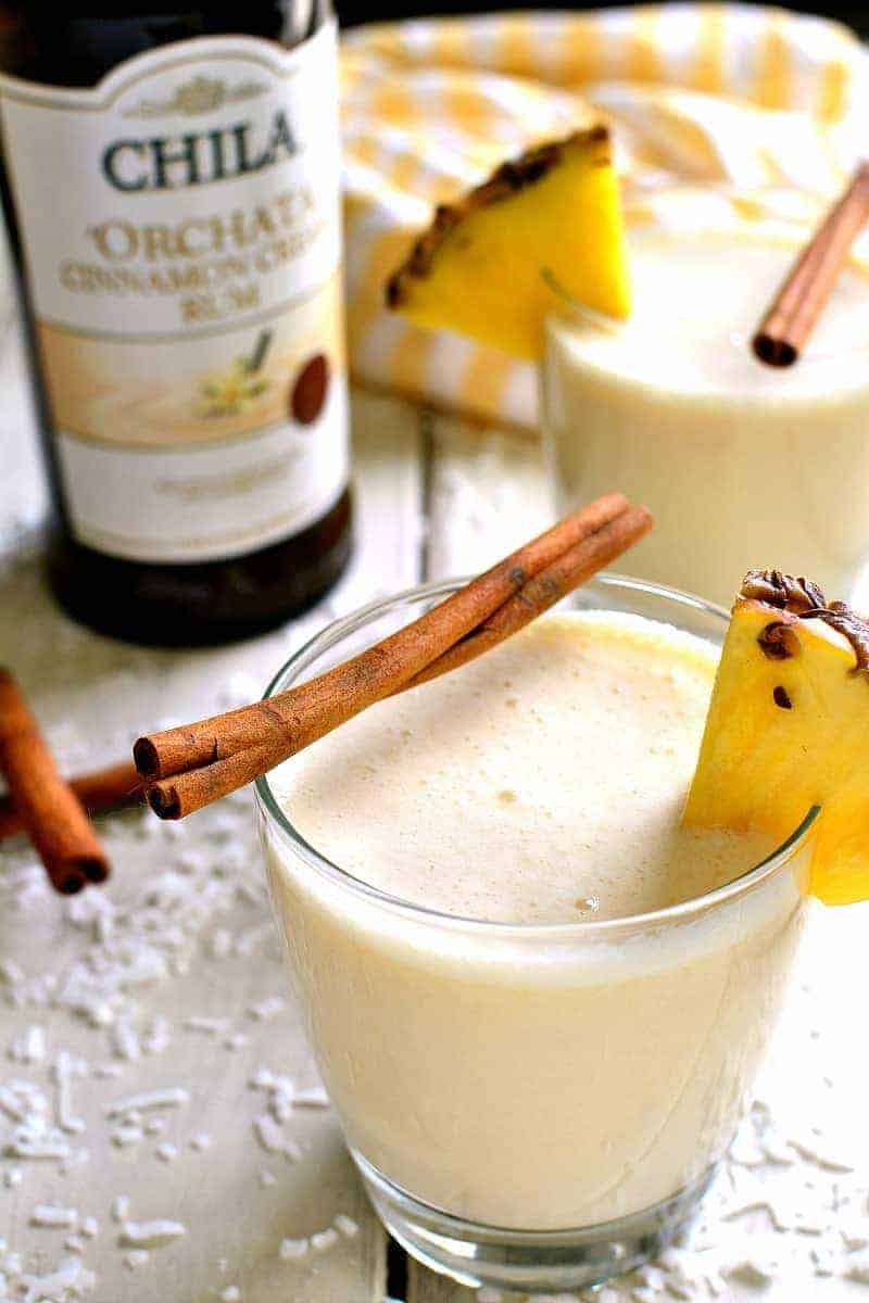'Orchata Coladas combine the classic flavors of piña coladas with sweet Cinnamon Cream Rum in a drink that's creamy, delicious, and perfect for summer! 
