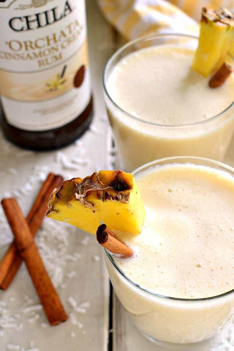 'Orchata Coladas combine the classic flavors of piña coladas with sweet Cinnamon Cream Rum in a drink that's creamy, delicious, and perfect for summer! 