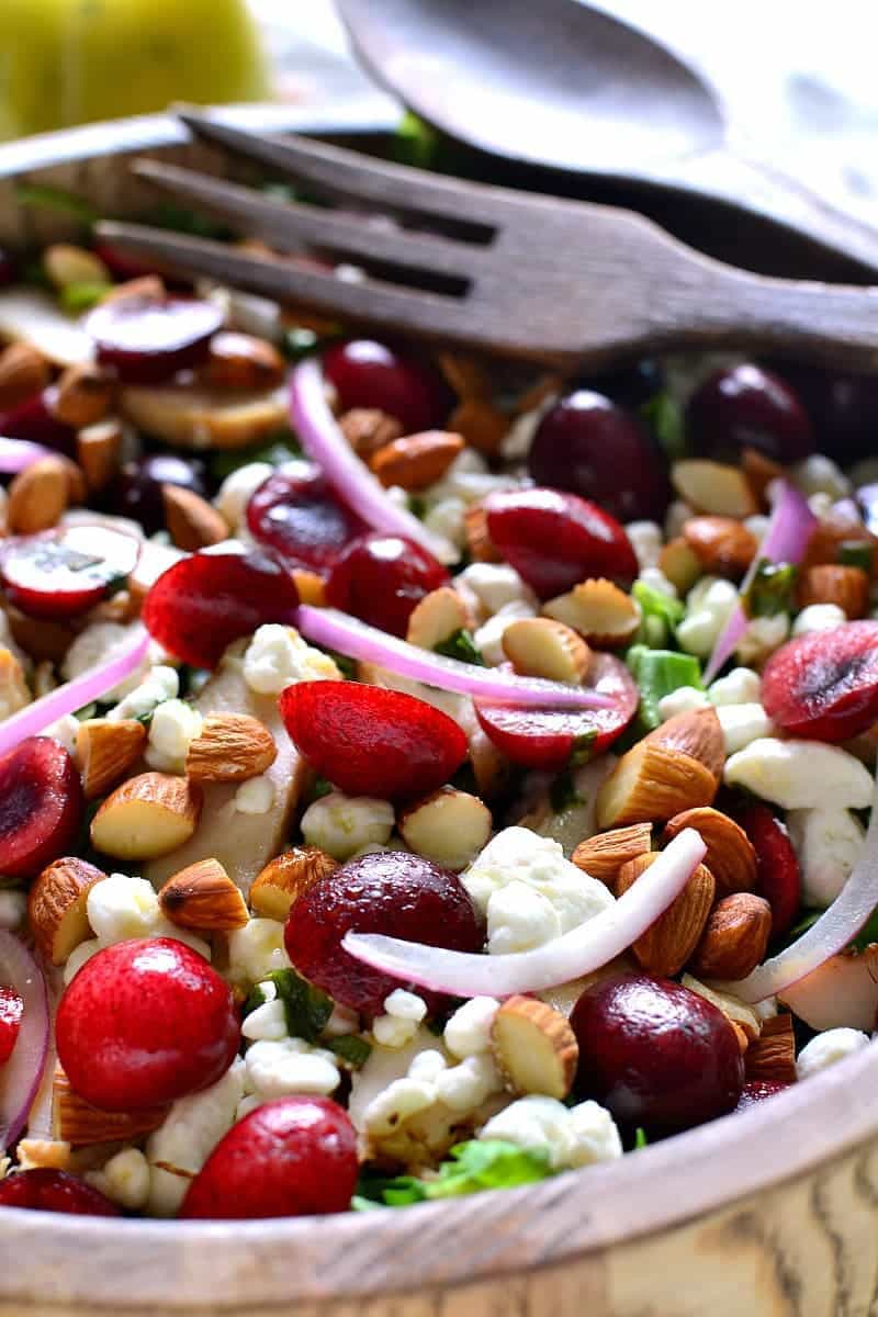 This Cherry Almond Arugula Salad combines fresh baby arugula with sweet cherries, almonds, goat cheese, and grilled chicken for delicious summer salad that's perfect as a main dish or on the side!
