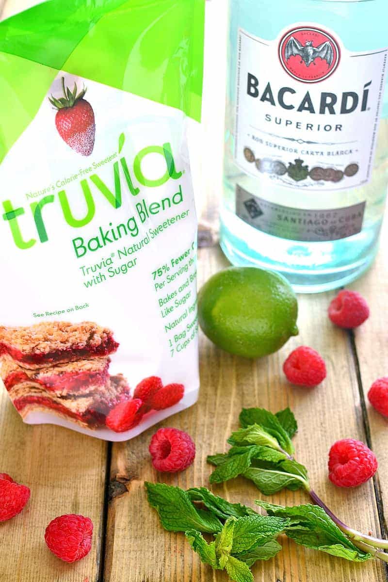 Skinny Raspberry Mojitos combine classic mojito flavors with fresh raspberries in a skinny cocktail that's perfect for summer!