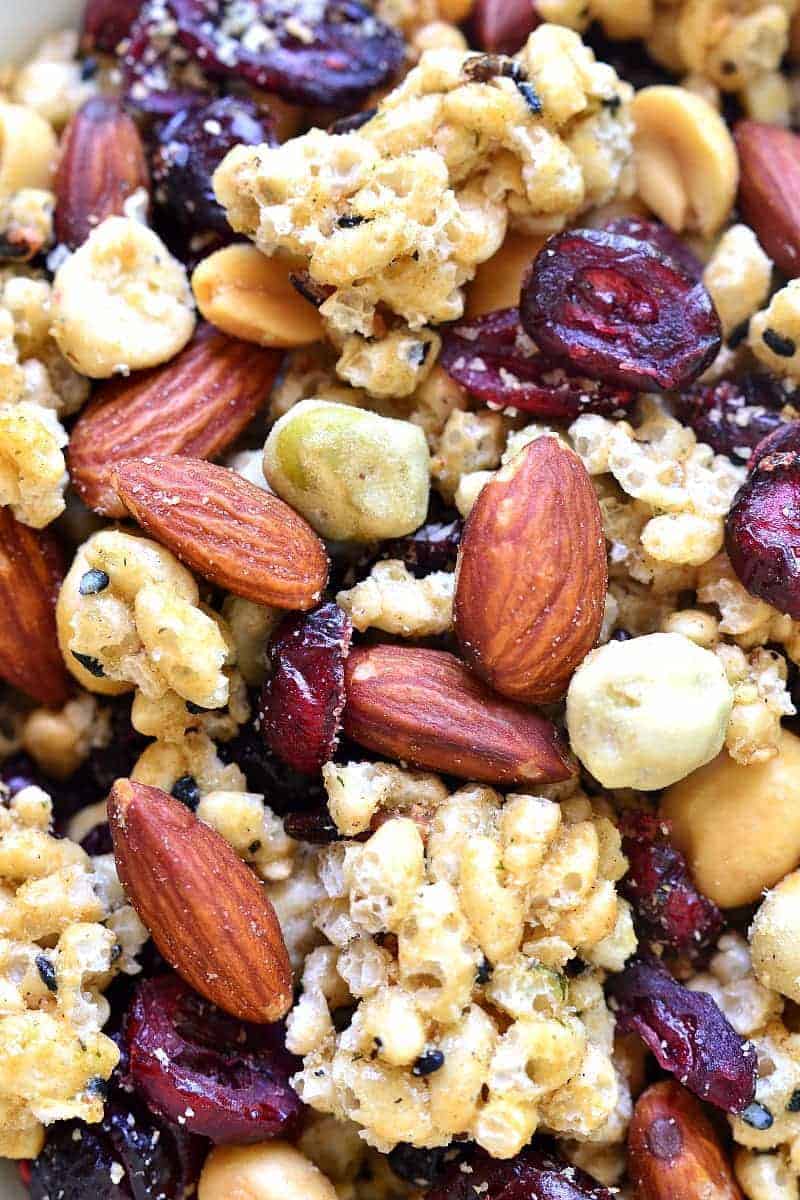 This Ginger Sesame Snack Mix combines the delicious flavors of sesame and ginger with roasted almonds, wasabi peas, salted peanuts, and dried cranberries. An unexpected blend of savory and sweet, this snack mix is bold, crunchy, and so addictive!