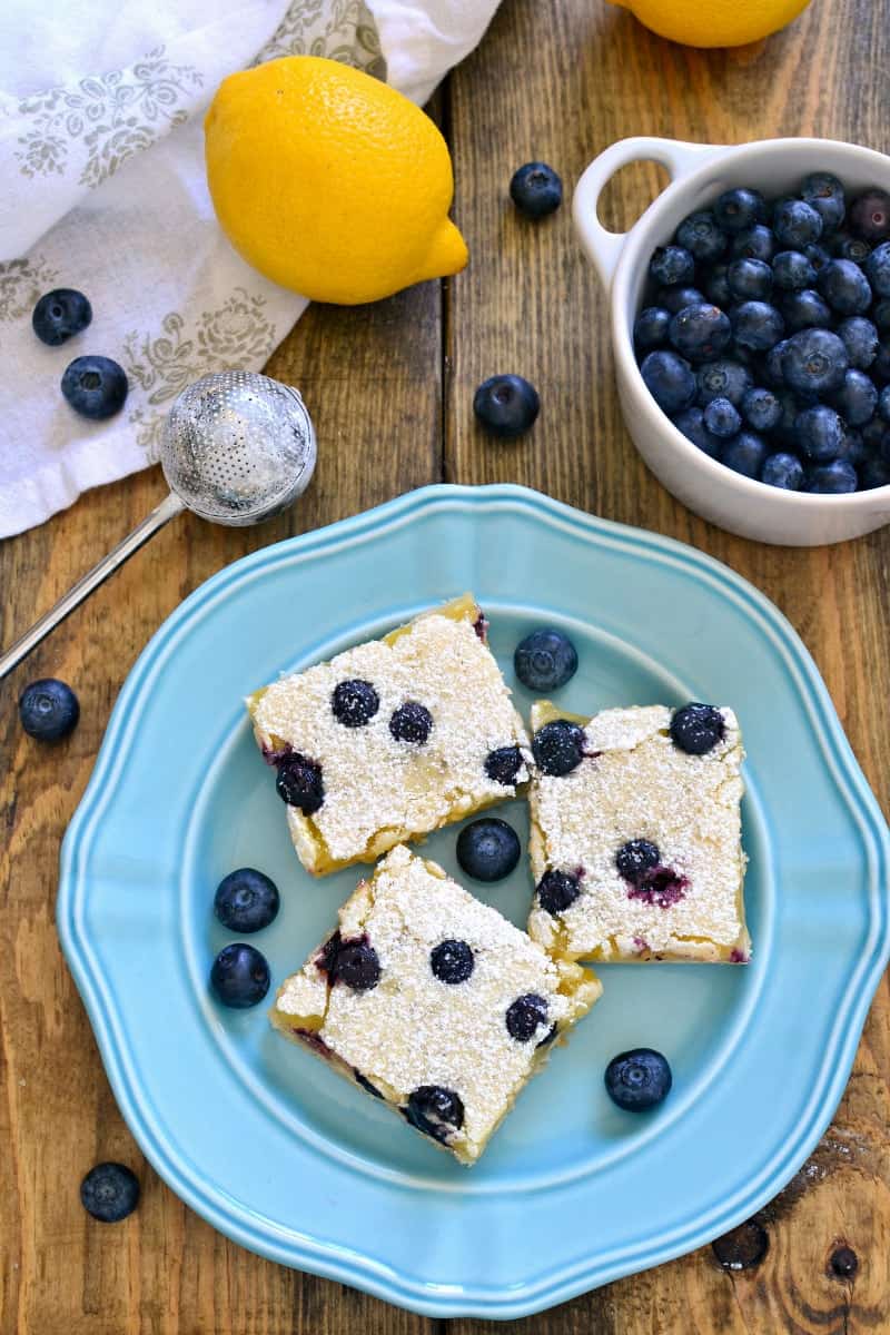 These Blueberry Lemon Bars take the classic bars to the next level with the addition of fresh blueberries! Deliciously sweet and perfect for summer!