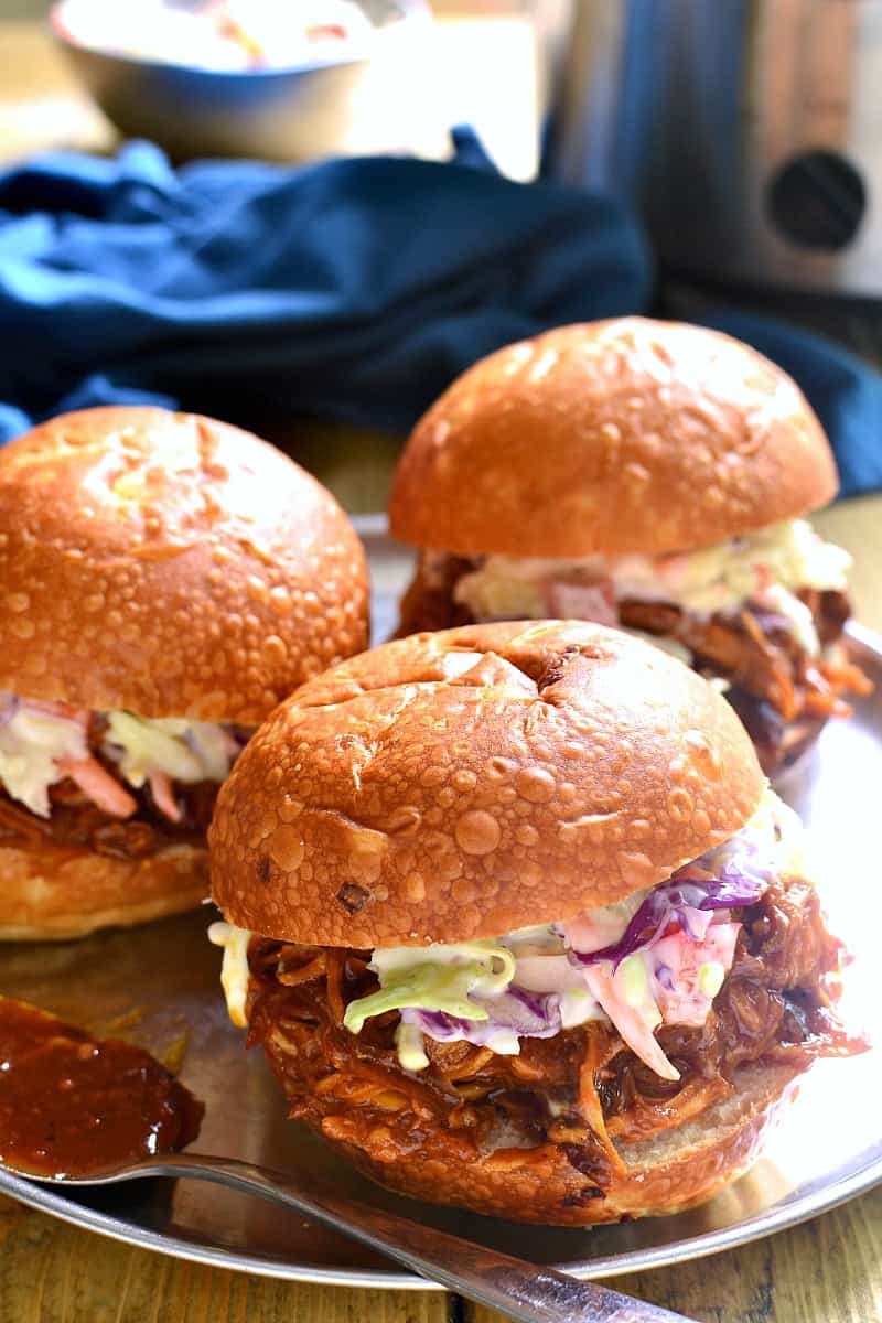 This Slow Cooker Hawaiian Chicken is sweet and smoky and slow cooked to perfection. It makes a great sandwich, and is perfect for family dinners, parties, game day, or anytime you're looking for something super easy & incredibly delicious!