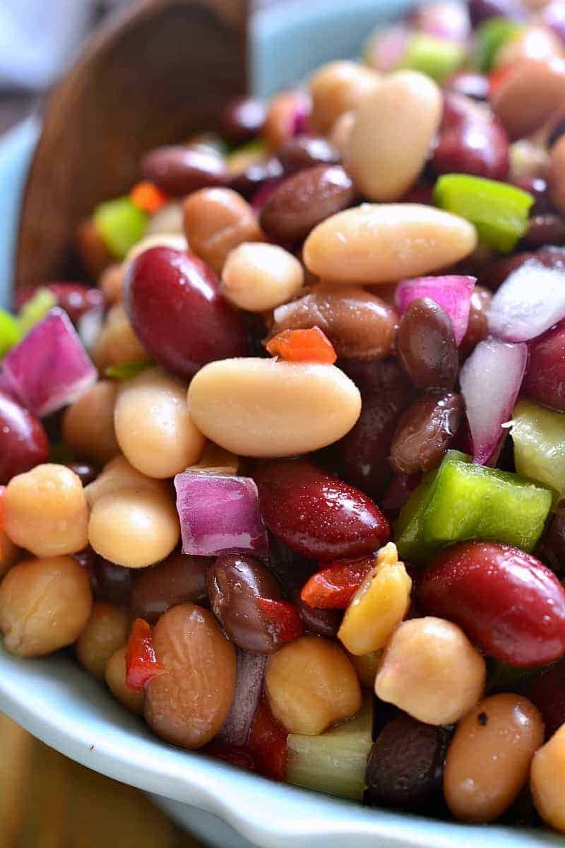 This 5-Bean Salad combines black, pinto, garbanzo, cannellini, and kidney beans with green peppers, pimentos, and red onions in a sweet dressing that ties it all together in the most delicious way!