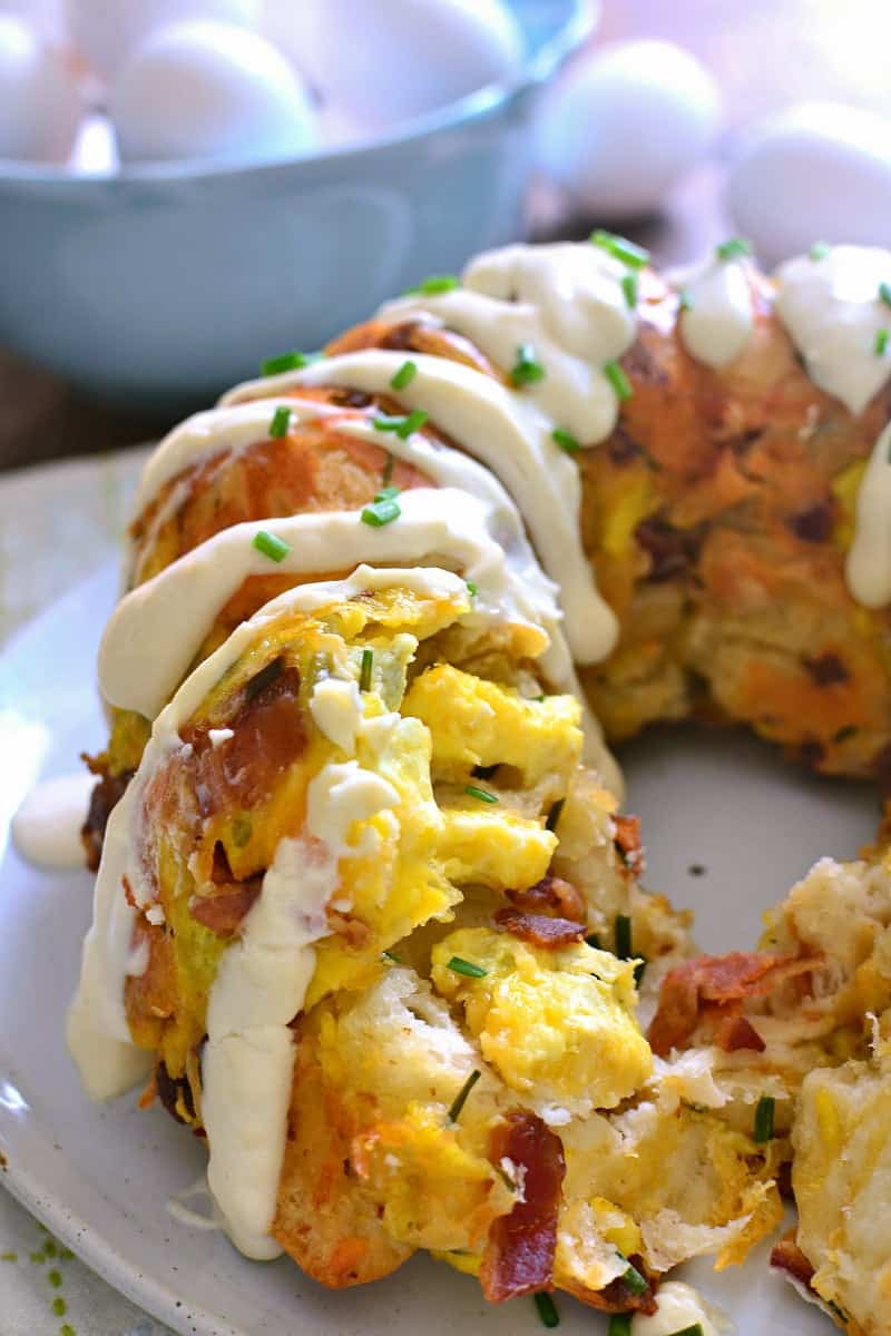 This Bacon, Egg & Cheese Monkey Bread combines all your breakfast favorites in one delicious pull-apart bread! Perfect for breakfast or an easy weeknight dinner, and just in time for back to school!