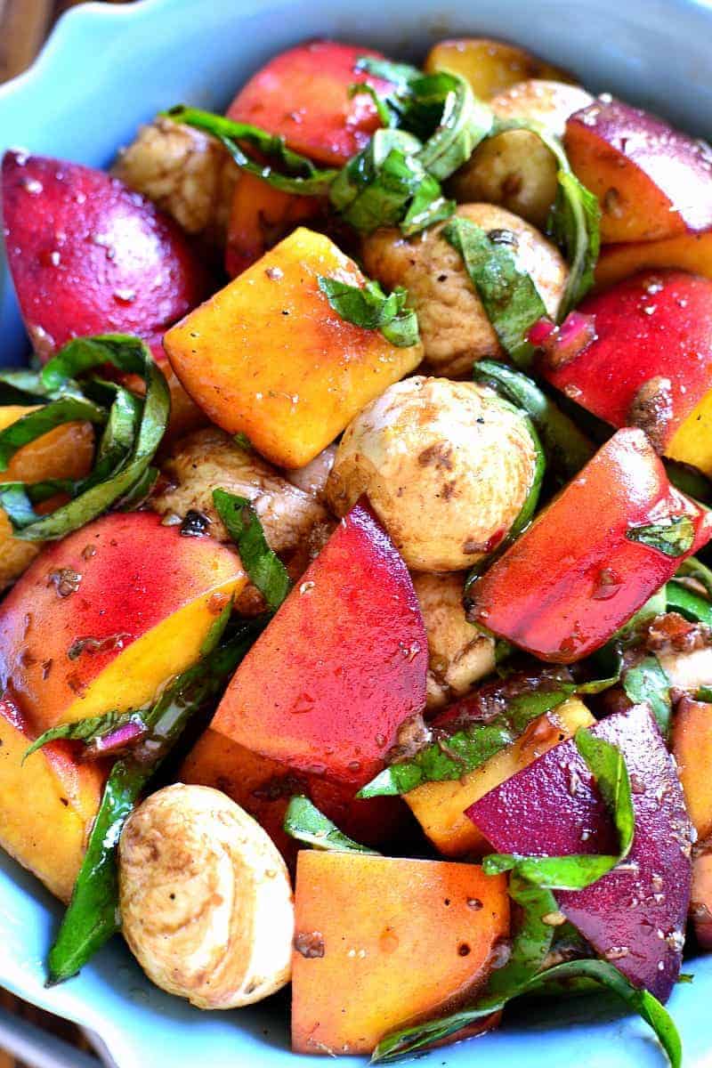 Caprese Peach Salad combines the classic caprese flavors with fresh peaches and homemade balsamic vinaigrette! The perfect end of summer salad!