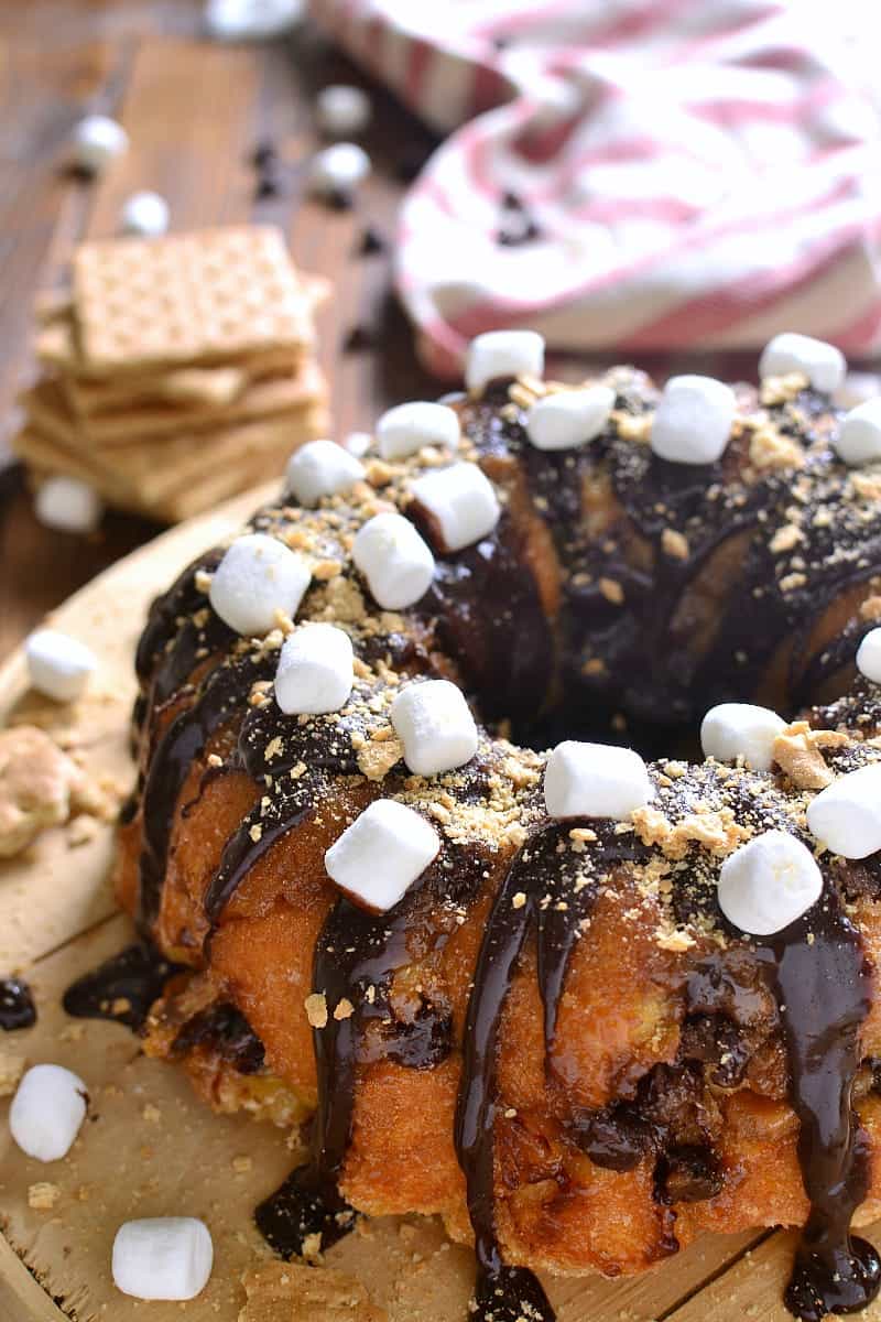 S'mores Monkey Bread is loaded with chocolate, marshmallows, and graham cracker crumbs....and seriously addictive! Grab a piece quickly because this is one treat that won't last long!