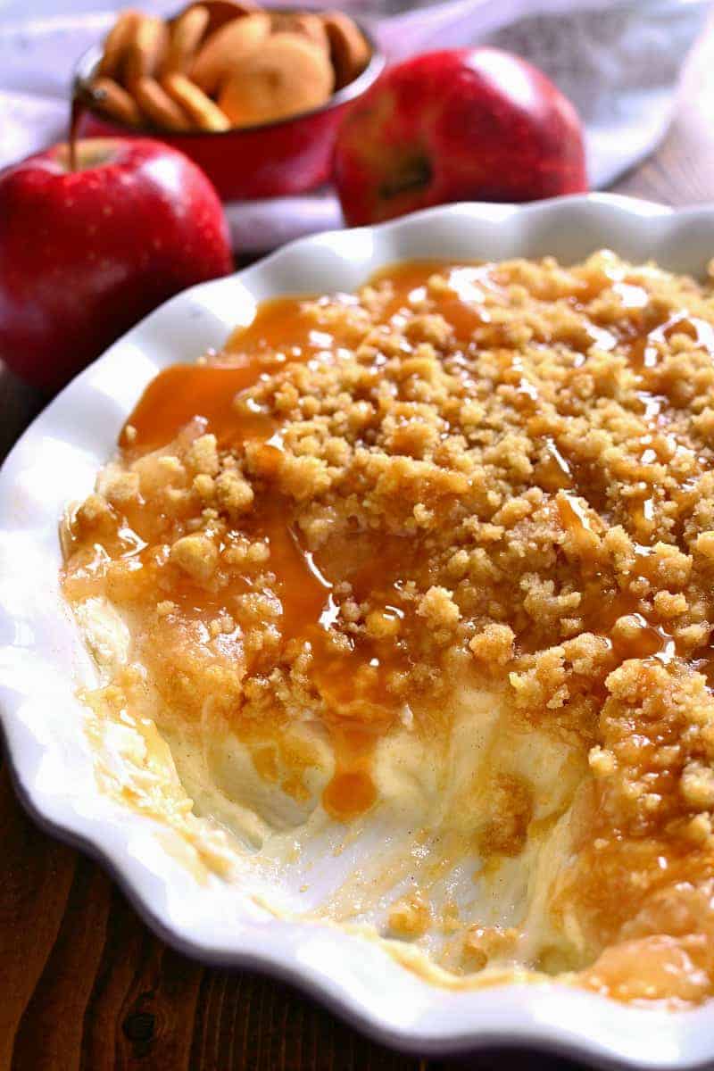This Baked Caramel Apple Cheesecake Dip is ooey, gooey, and perfect for fall! Enjoy it with graham crackers, vanilla wafers, or any of your favorite dippers. Sure to be a new family favorite!
