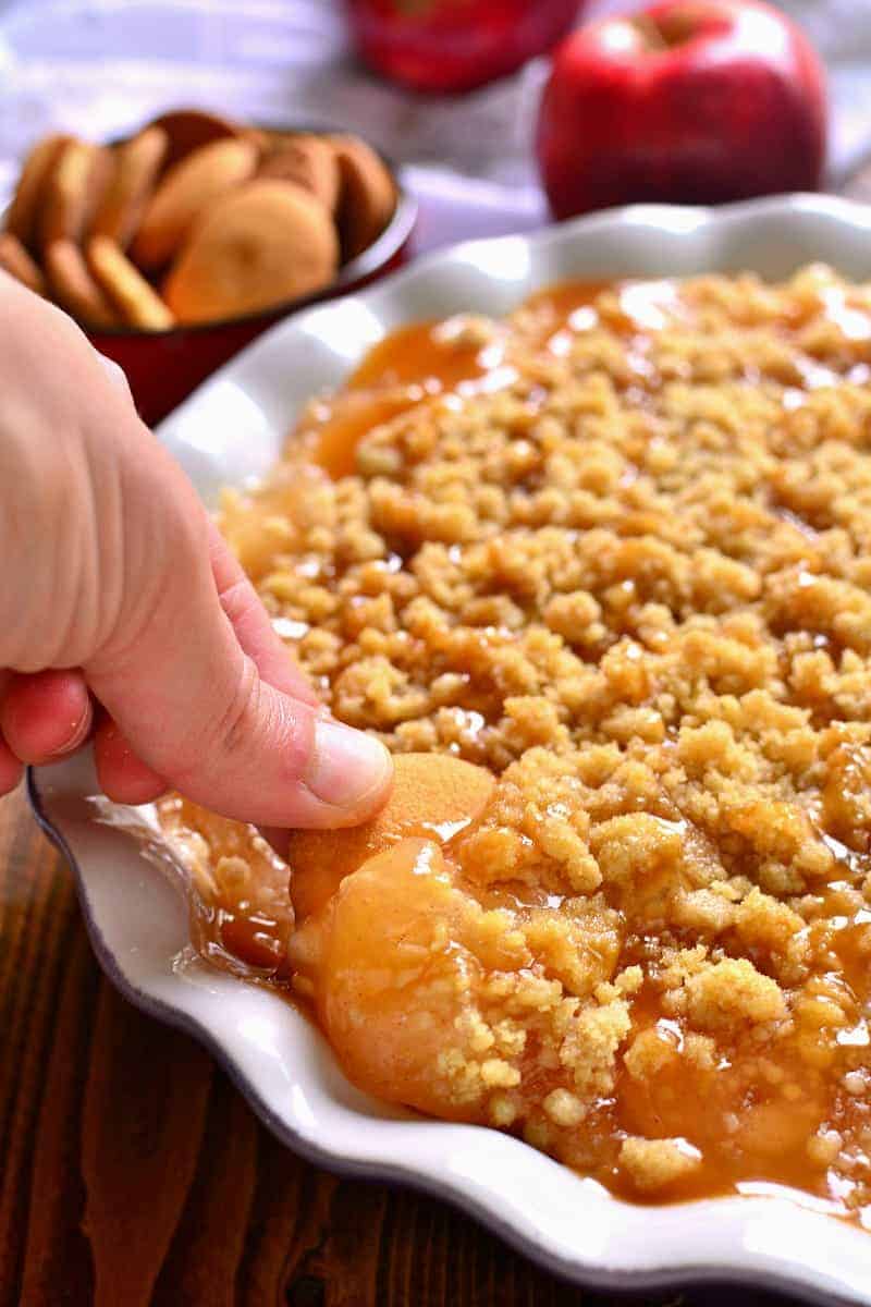 This Baked Caramel Apple Cheesecake Dip is ooey, gooey, and perfect for fall! Enjoy it with graham crackers, vanilla wafers, or any of your favorite dippers. Sure to be a new family favorite!