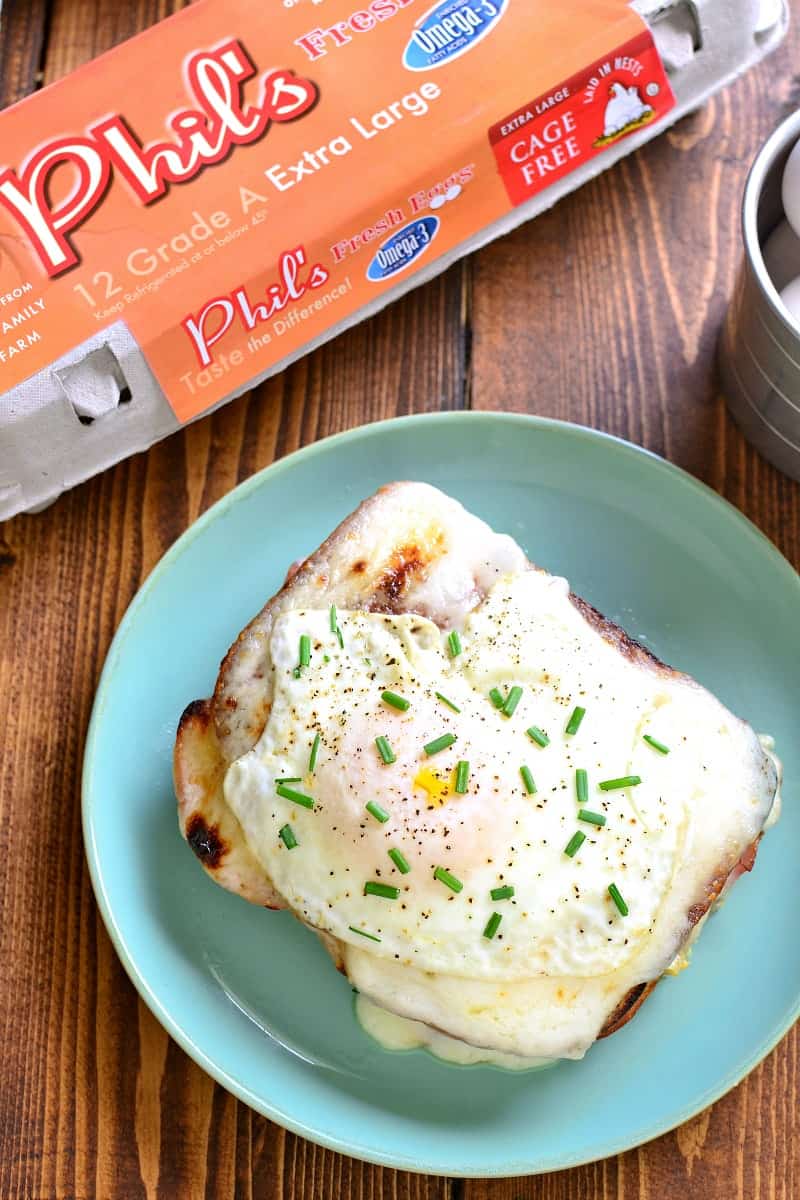 A Classic Croque Madame - made with sliced ham, swiss cheese, creamy béarnaise sauce, and a fried egg on top. Go ahead....indulge! It's worth it!