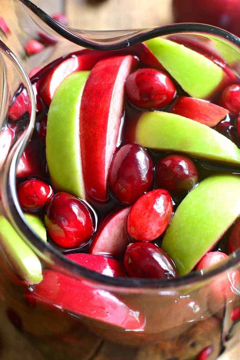 This Cranberry Apple Sangria is a deliciously sweet taste of fall! Loaded with fresh, seasonal fruit and packed with flavor, it's sure to become a new fall favorite! Perfect for the holidays, too!