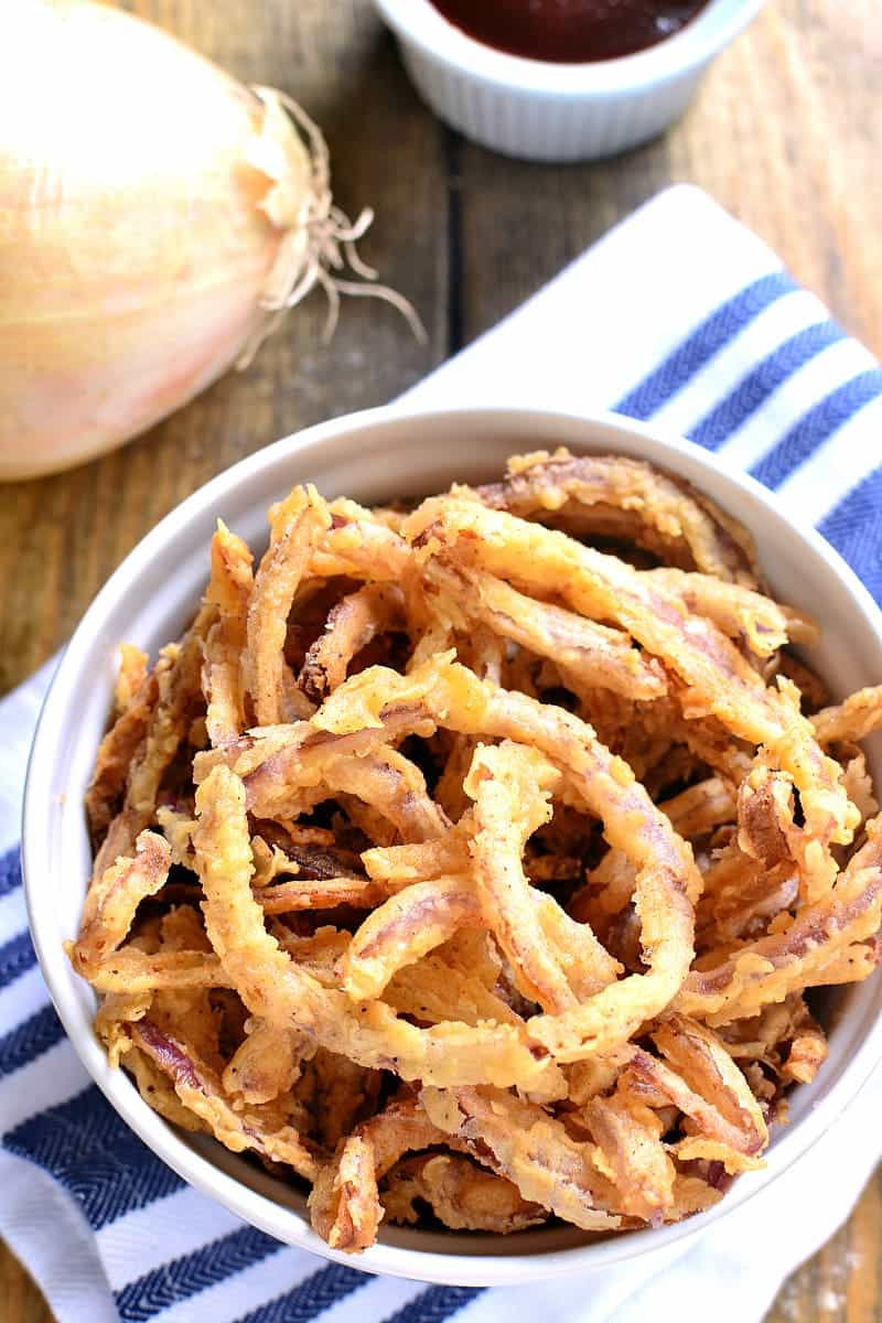 These easy Crispy Onion Strings are the perfect topping for sandwiches, salads, and soups....or delicious all on their own!