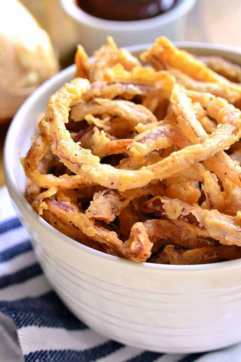 These easy Crispy Onion Strings are the perfect topping for sandwiches, salads, and soups....or delicious all on their own!