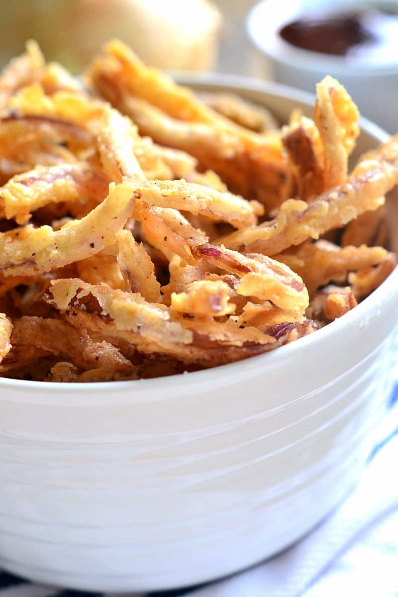 These easy Crispy Onion Strings are the perfect topping for sandwiches, salads, and soups....or delicious all on their own!