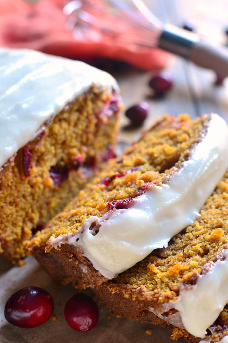 Cranberry pumpkin bread is the BEST pumpkin bread recipe, made better with the addition of fresh cranberries and sweet cream cheese icing! The perfect dessert or brunch recipe for your holiday table!