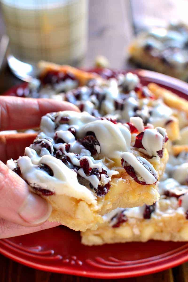 White Chocolate Cranberry Macadamia Magic Bars are a great way to take your Christmas treats to the next level! An easy dessert recipe with just 6 ingredients is perfect for the holidays!