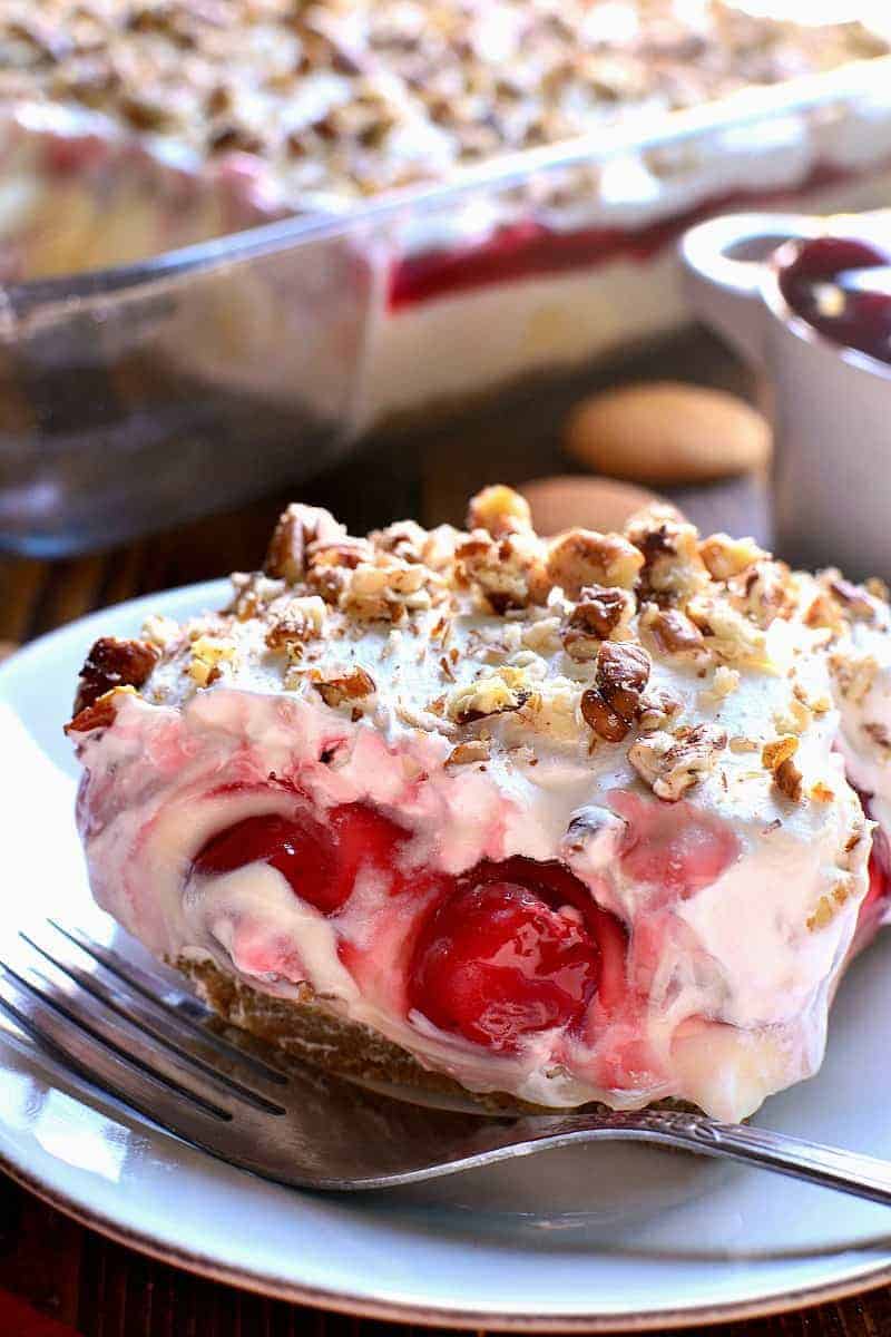 This Cherry Cheesecake Lush Dessert combines all the flavors of cherry cheesecake with the creaminess of lush! The perfect dessert for the holidays and all year round!