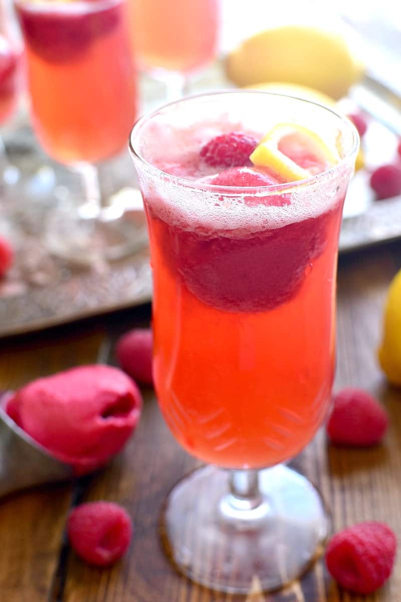 This Lemon Raspberry Champagne Float is the perfect way to ring in the New Year! It's simple, festive, and oh so delicious - the ideal drink for any celebration!