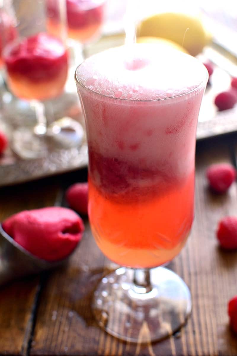 This Lemon Raspberry Champagne Float is the perfect way to ring in the New Year! It's simple, festive, and oh so delicious - the ideal drink for any celebration!