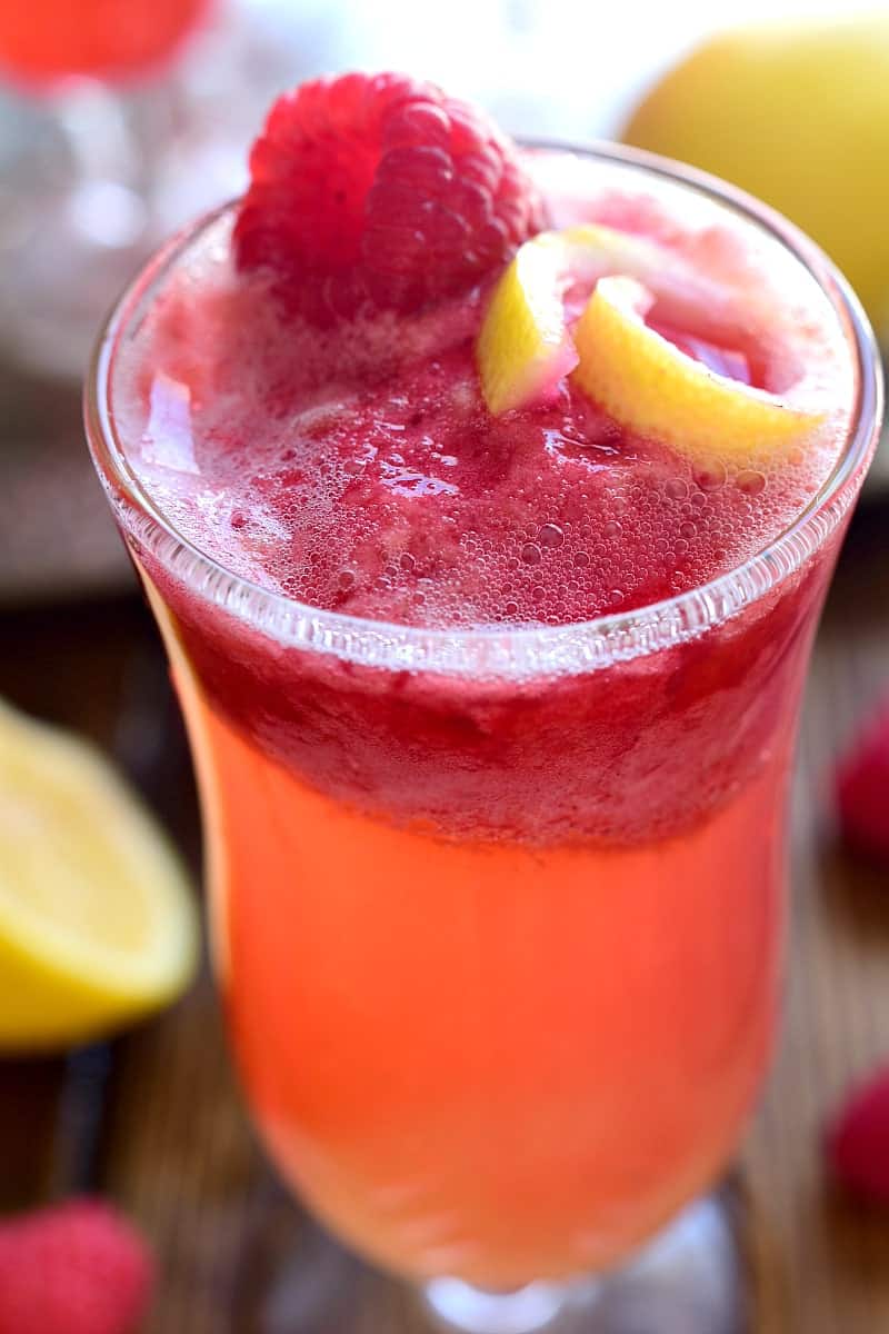 This Lemon Raspberry Champagne Float is the perfect way to ring in the New Year! It's simple, festive, and oh so delicious - the ideal drink for any celebration!