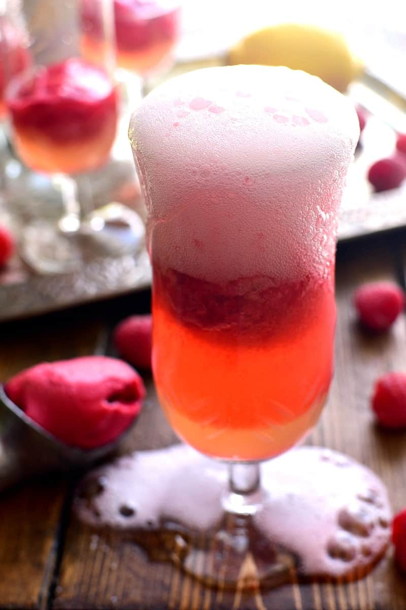 This Lemon Raspberry Champagne Float is the perfect way to ring in the New Year! It's simple, festive, and oh so delicious - the ideal drink for any celebration!