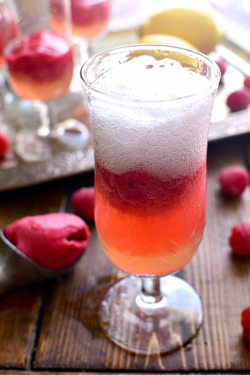 This Lemon Raspberry Champagne Float is the perfect way to ring in the New Year! It's simple, festive, and oh so delicious - the ideal drink for any celebration!