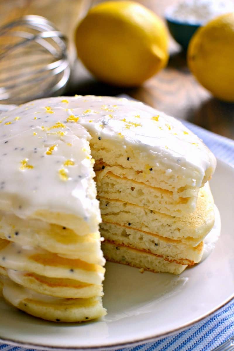 These Lemon Poppy Seed Pancakes are light, fluffy, and bursting with lemon flavor! Try them with lemon poppy seed glaze for a sweet, tart, delicious start to your day.