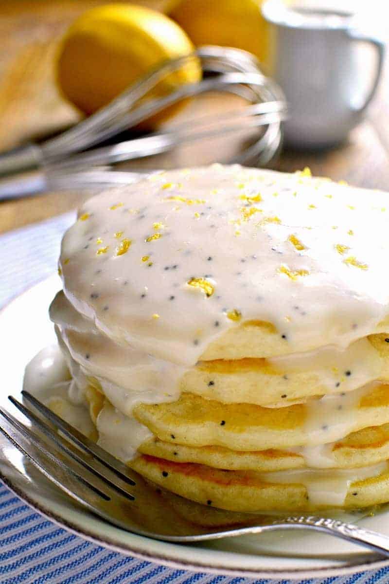 These Lemon Poppy Seed Pancakes are light, fluffy, and bursting with lemon flavor! Try them with lemon poppy seed glaze for a sweet, tart, delicious start to your day.