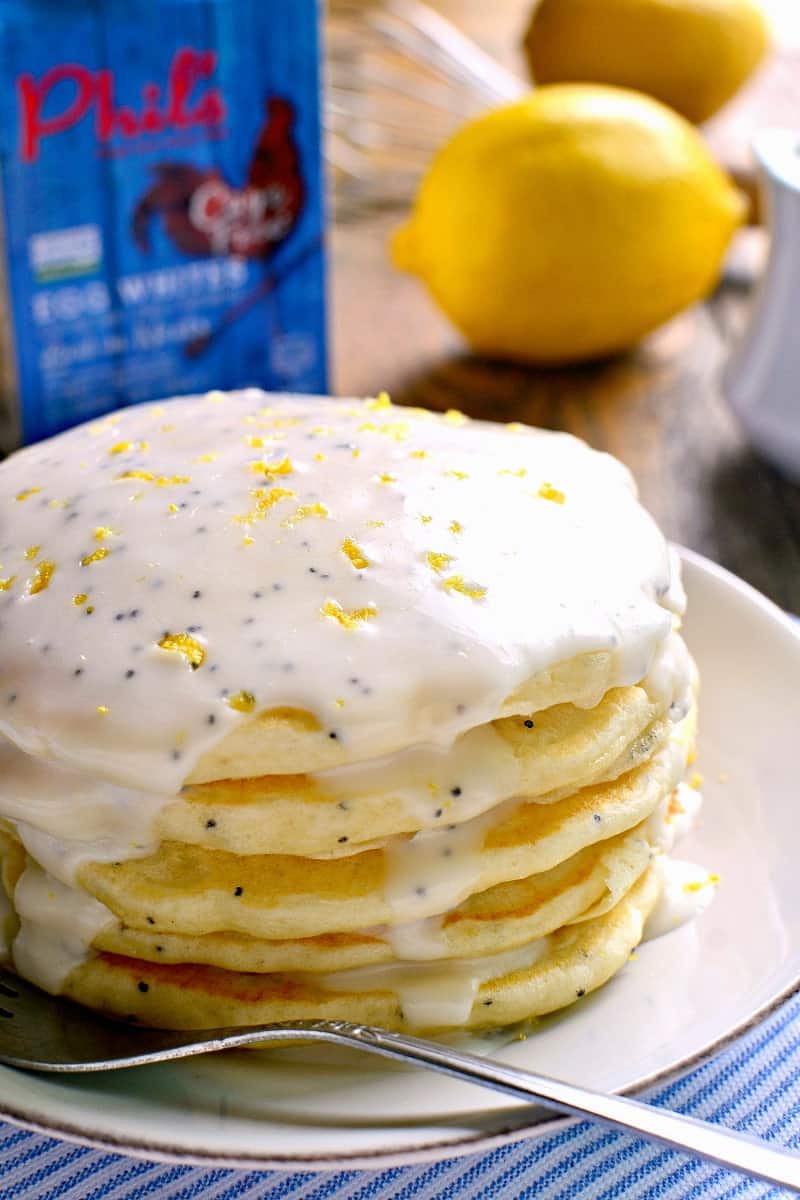 These Lemon Poppy Seed Pancakes are light, fluffy, and bursting with lemon flavor! Try them with lemon poppy seed glaze for a sweet, tart, delicious start to your day.