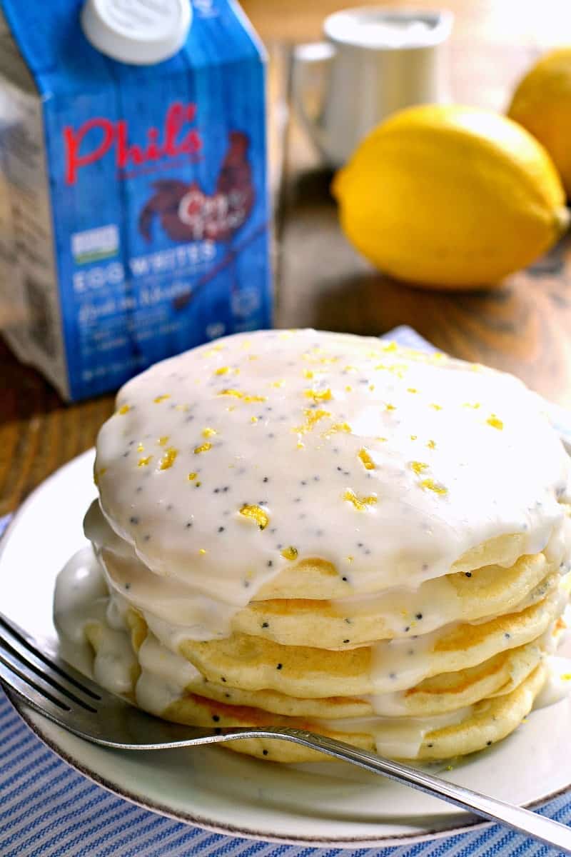 These Lemon Poppy Seed Pancakes are light, fluffy, and bursting with lemon flavor! Try them with lemon poppy seed glaze for a sweet, tart, delicious start to your day.