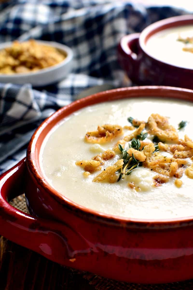 This Cheesy Cauliflower Soup is creamy, comforting, and packed with delicious flavor! Perfect for busy weeknights or lazy weekends at home....and you won't believe how easy it is to make!