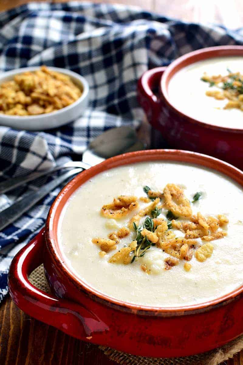 This Cheesy Cauliflower Soup is creamy, comforting, and packed with delicious flavor! Perfect for busy weeknights or lazy weekends at home....and you won't believe how easy it is to make!