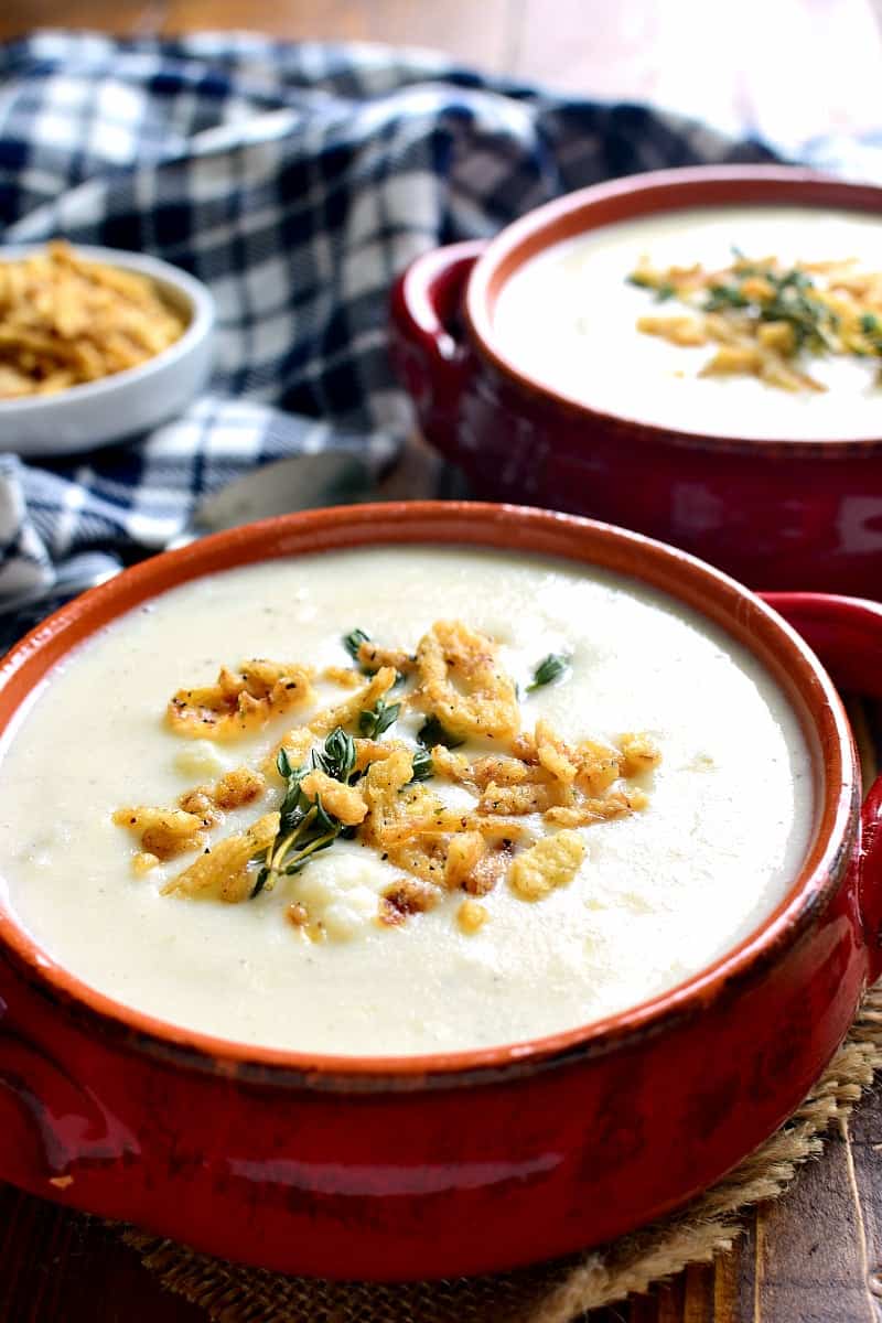 This Cheesy Cauliflower Soup is creamy, comforting, and packed with delicious flavor! Perfect for busy weeknights or lazy weekends at home....and you won't believe how easy it is to make!