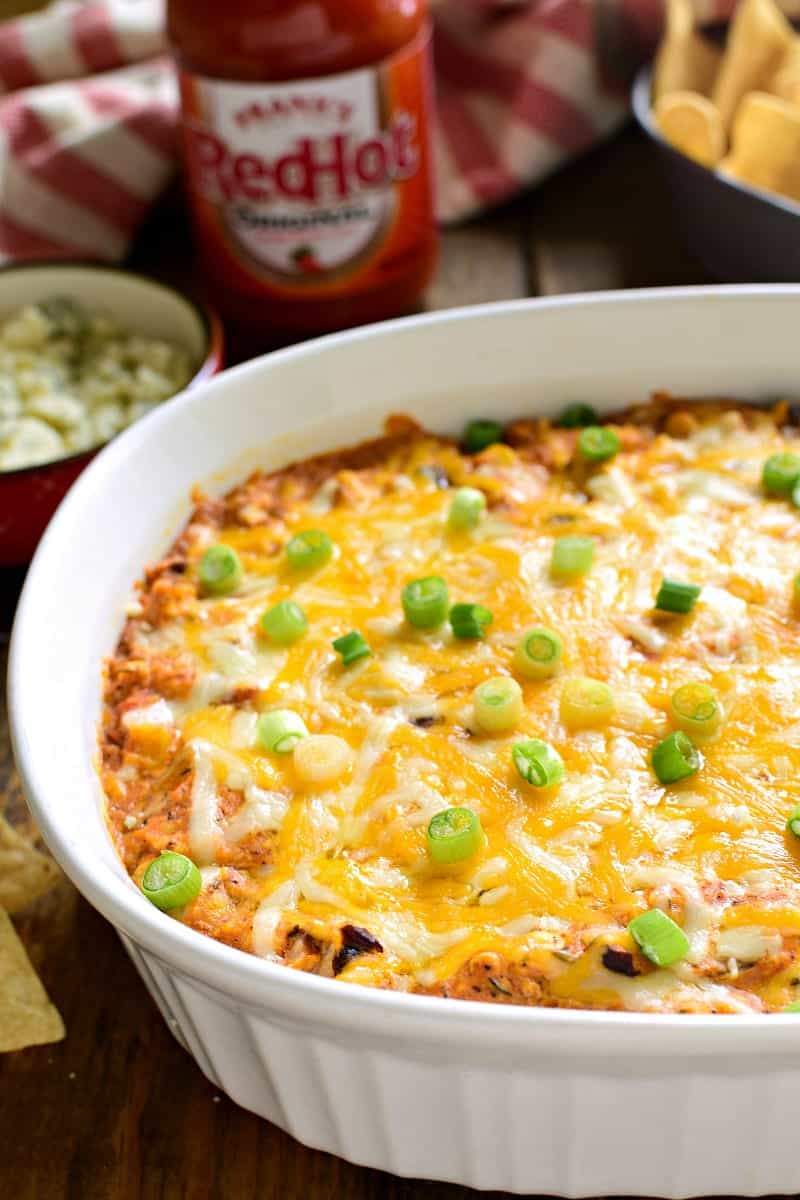 This Southwest Buffalo Chicken Dip puts a southwest spin on a party favorite! It's gooey, cheesy, and loaded with delicious flavor....perfect for game day!
