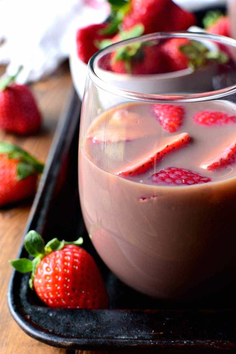 Chocolate Sangria - made with just 3 ingredients and garnished with fresh strawberries! This sangria is the ultimate rich, creamy, chocolatey cocktail....perfect for Valentine's Day or just because.