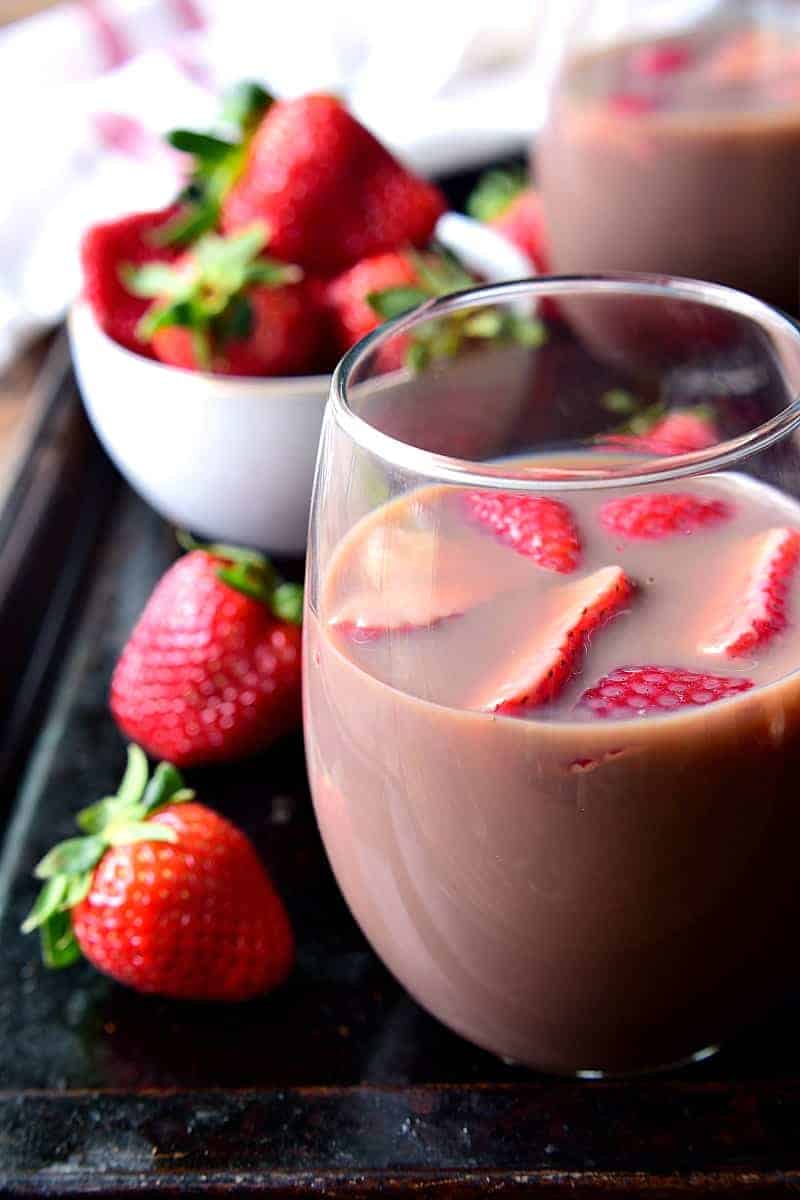 Chocolate Sangria - made with just 3 ingredients and garnished with fresh strawberries! This sangria is the ultimate rich, creamy, chocolatey cocktail....perfect for Valentine's Day or just because.