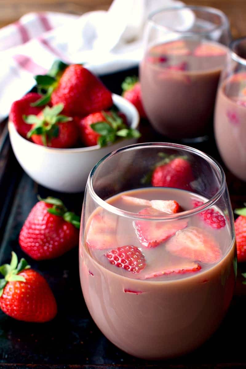 Chocolate Sangria - made with just 3 ingredients and garnished with fresh strawberries! This sangria is the ultimate rich, creamy, chocolatey cocktail....perfect for Valentine's Day or just because.