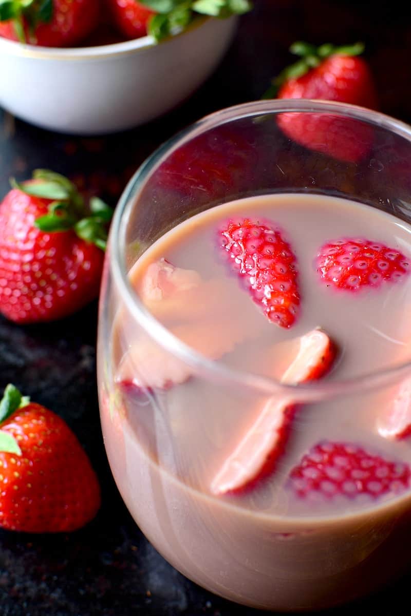 Chocolate Sangria - made with just 3 ingredients and garnished with fresh strawberries! This sangria is the ultimate rich, creamy, chocolatey cocktail....perfect for Valentine's Day or just because.