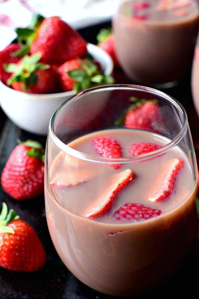 Chocolate Sangria - made with just 3 ingredients and garnished with fresh strawberries! This sangria is the ultimate rich, creamy, chocolatey cocktail....perfect for Valentine's Day or just because.