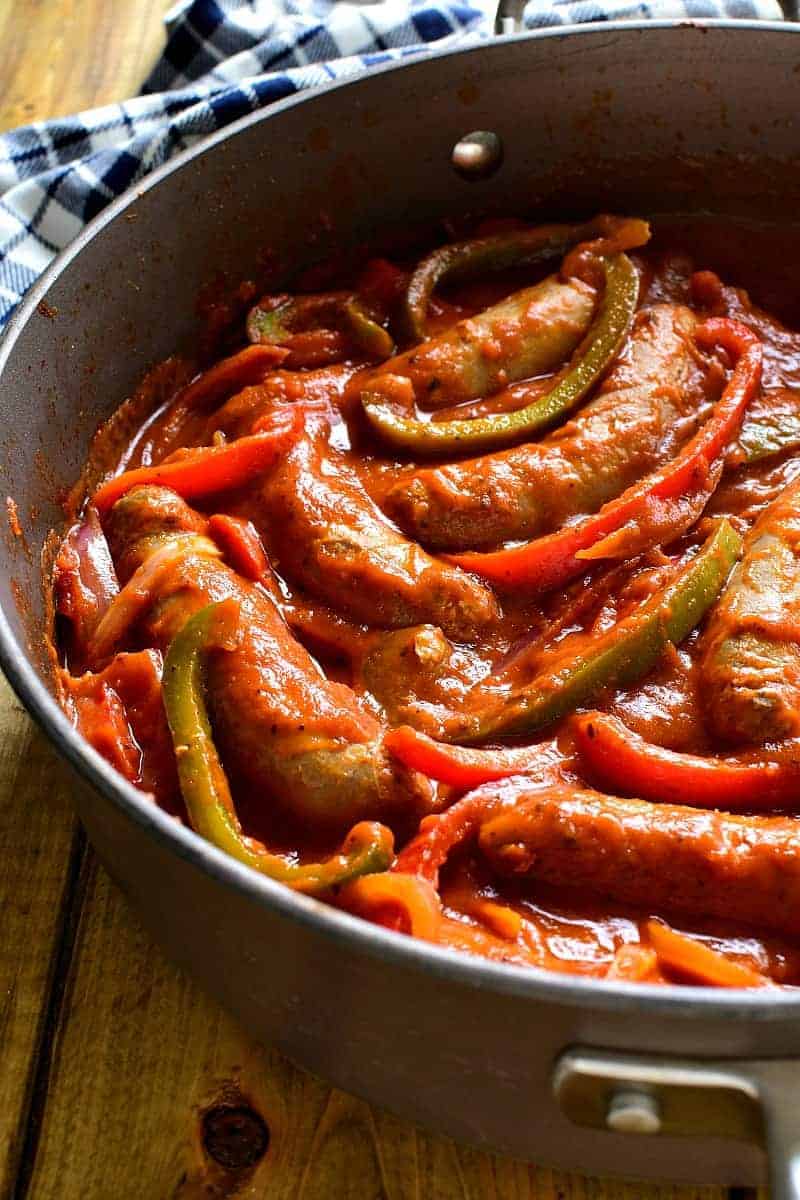 These Sausage & Pepper Sandwiches are like comfort in a sandwich roll! They combine the delicious flavor of Italian Sausages with fresh red & green peppers, onion, spices, and marinara sauce. Perfect for game days or easy weeknight dinners...they're sure to become a new family favorite!