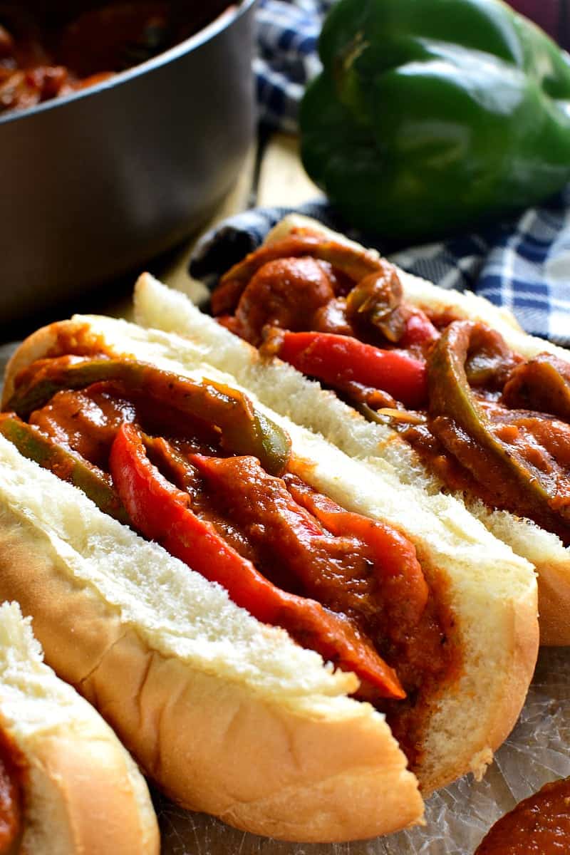 These Sausage & Pepper Sandwiches are like comfort in a sandwich roll! They combine the delicious flavor of Italian Sausages with fresh red & green peppers, onion, spices, and marinara sauce. Perfect for game days or easy weeknight dinners...they're sure to become a new family favorite!